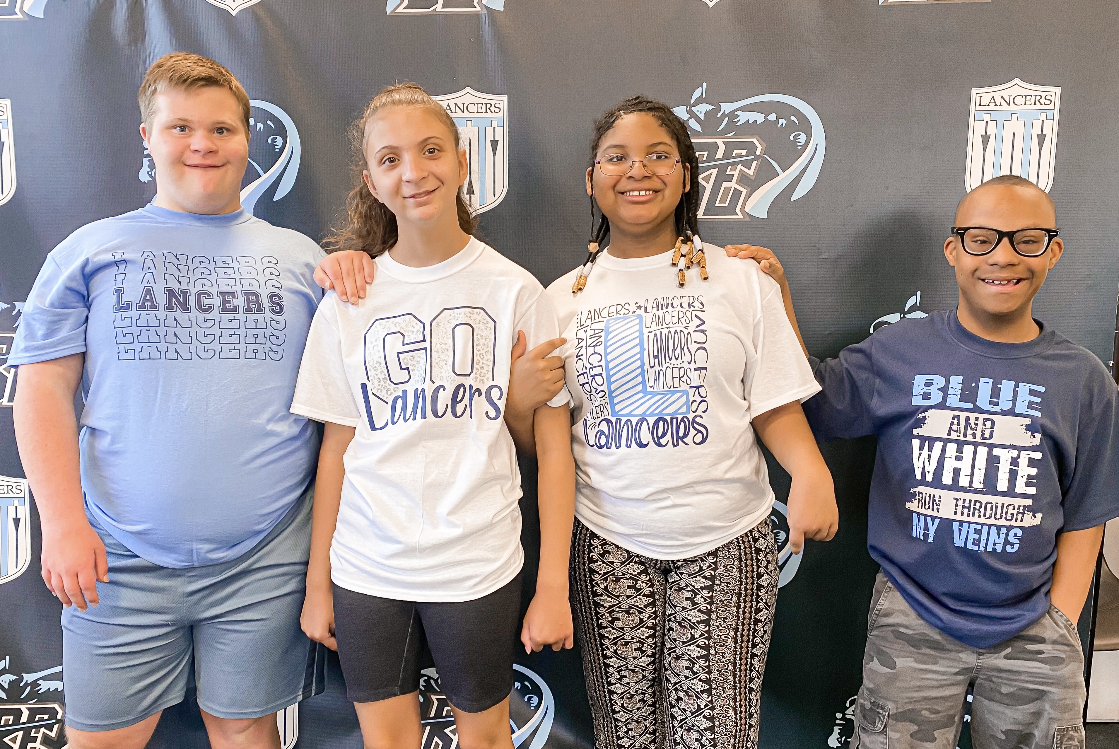 Students Modeling Spirit Wear Shirts